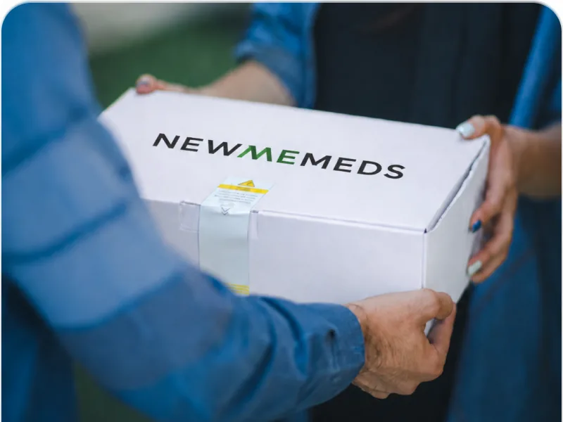 Member receiving a branded Newmemeds delivery box